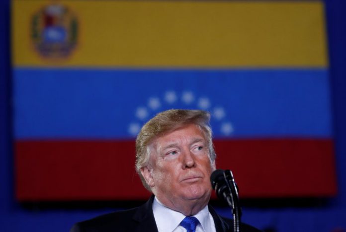U.S. President Donald Trump pauses while speaking about the crisis in Venezuela during a visit to Florida International University in Miami