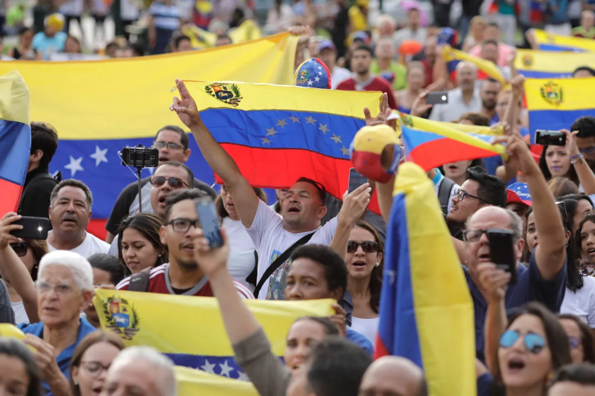 Protestors demonstrate against Venezuela’s President Nicolás Maduro’s government at Plaza Bolivar in Lima, Peru. Source: Guadalupe Pardo/Reuters.